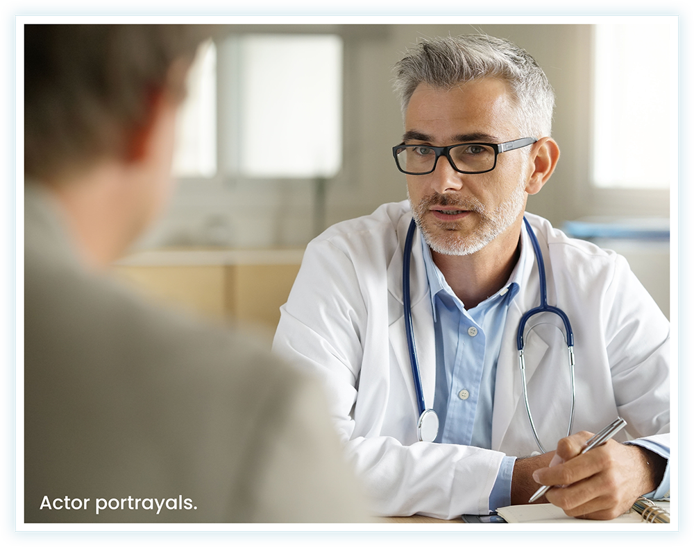 Patient talking with their doctor about EXSERVAN™ (actor portrayals)